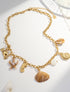Goldene Edelstahlkette mit maritimen Anhängern und echten Muscheln, wasserfest & allergenfrei