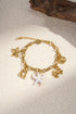 Charm-Armband mit Meeresmotiven wie Seestern, Muschel, Krabbe und Delfinen, goldfarben, Edelstahl 18K vergoldet, maritimer Schmuck für Damen