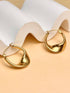 Goldene Statement-Creolen in fließender, organischer Form – eleganter Edelstahl-Schmuck, 18K vergoldet, nickel- und schadstofffrei